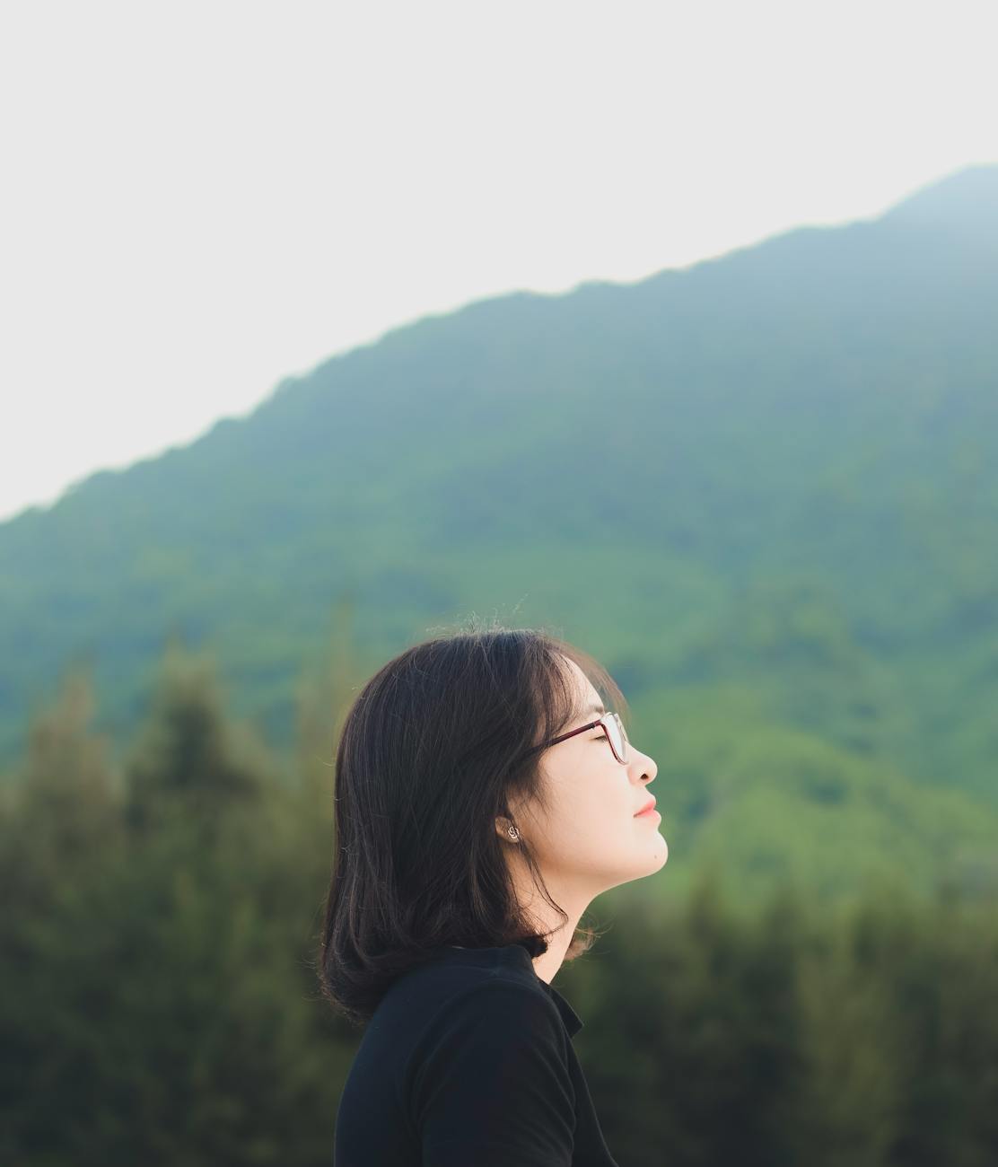young woman gazing at scenic mountain view